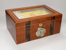 A sealed case of Monte Cristo Habana cigars together with a humidor, the humidor 16cm high x 34.