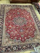 A North West Persian red ground floral carpet, 320 x 234cm