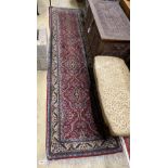 A North West Persian red ground runner, 322 x 79cm