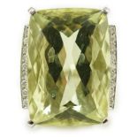 A modern white gold and shaped rectangular fancy cut pale green beryl set dress ring, with diamond
