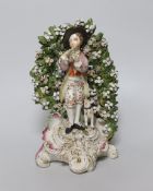 An 18th century Derby figure group of a boy playing a flute, 1770’s, 22cm high