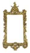 A 19th century Chippendale style carved giltwood wall mirror, with foliate scroll frame and