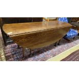 A reproduction 18th century style oak drop leaf wake table, length 196cm, width 153cm extended,