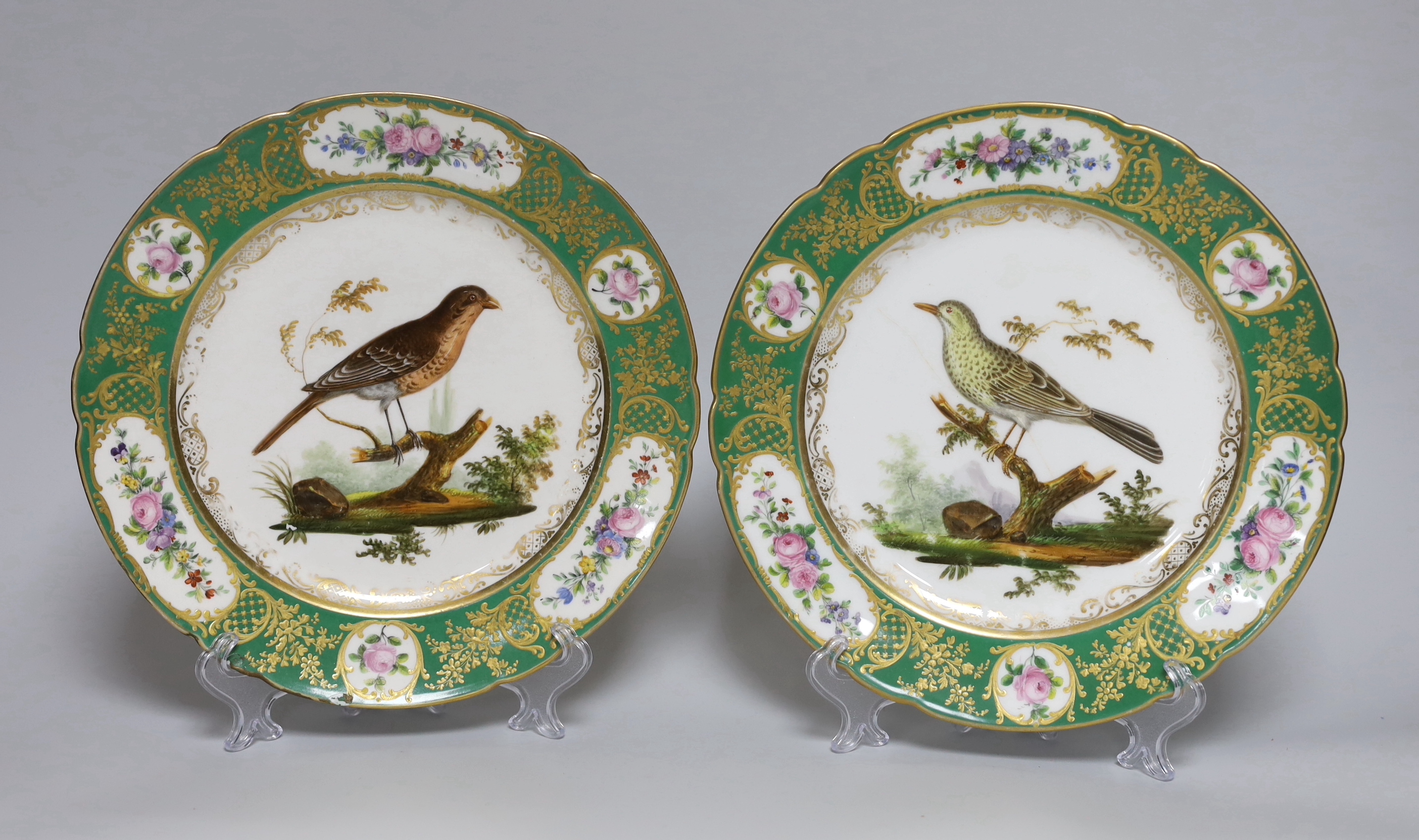 A pair of early 19th century Paris porcelain ornithological plates each painted by Jean-Pierre
