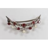 A late Victorian yellow metal, diamond, ruby and seed pearl set crescent brooch, 45mm, gross