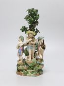 An 18th century Derby figure group of three putti, 22cm high