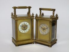 Two early 20th century brass carriage timepieces, one with silvered dial, the largest 15cm high