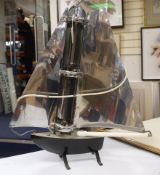 An Art Deco novelty yacht shaped chrome and black enamelled metal electric fire, by Bunting, 75cm