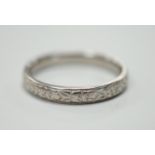 An engraved platinum wedding band, size M, 4.3 grams.