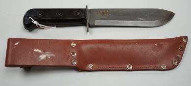 A British Army survival knife within sheath, 1987, numbered 127-8214