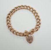 A 9ct gold curb link bracelet, with heart shaped padlock clasp, 18cm, 32.8 grams.