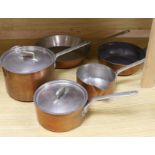 Three copper saucepans and two frying pans by Elkington and Co including two graduated pans with
