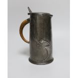 Archibald Knox for Liberty and Co., an Arts and Crafts Tudric pewter jug, model 0305, 15.5cm