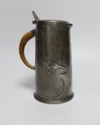 Archibald Knox for Liberty and Co., an Arts and Crafts Tudric pewter jug, model 0305, 15.5cm