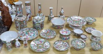A quantity of 19th century Chinese famille rose dishes, plates, teapots and vases, tallest 21.5cm
