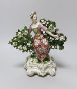 An 18th century Derby figure of a seated lady, 1770’s, 22cm