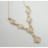 A modern 9k and six pave set diamond panel drop necklace, with rope twist borders, 52cm, gross