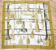 Four vintage Hermes silk scarves including one retailed by Harrods comprising, Selles A Housse,