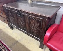 An 18th century carved oak coffer, length 133cm, depth 57cm, height 83cm