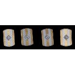 A pair of mid 20th century two colour 18ct gold and single stone diamond set cufflinks, of shaped