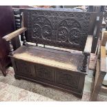 A 1920’s carved oak monk's bench, width 122cm, depth 51cm, height 78cm