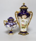 A Coalport vase and cover, painted with a bird on a blue and gilt ground, signed, green mark, and