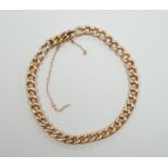 A 15c curb link bracelet, 19cm, 8.9 grams.