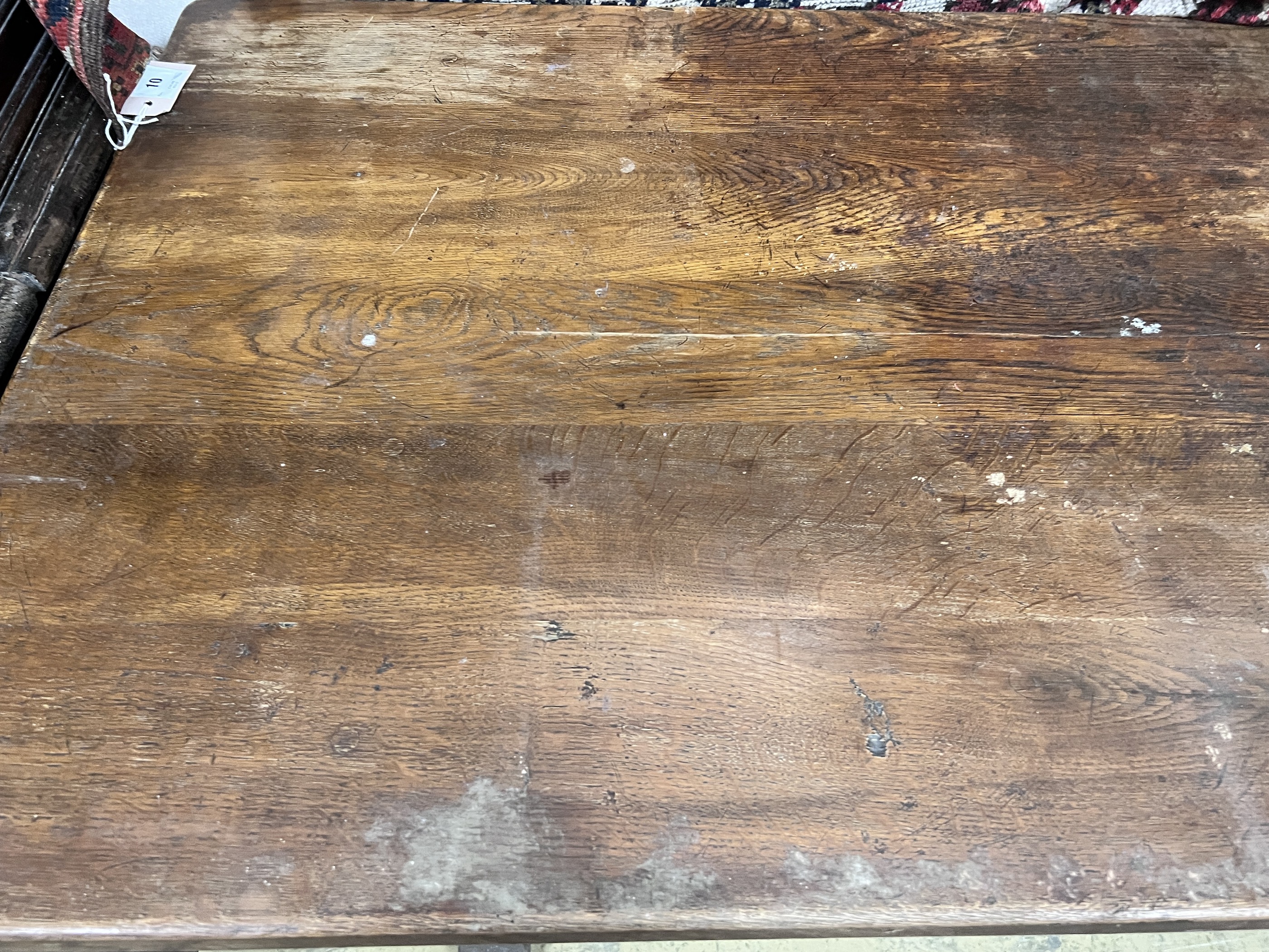 A 1920's rectangular oak dining table, length 145cm, depth 74cm, height 76cm - Image 3 of 5