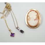 A modern 9ct gold mounted oval cameo shell brooch and two pendant necklaces including one 9ct.