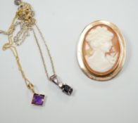 A modern 9ct gold mounted oval cameo shell brooch and two pendant necklaces including one 9ct.