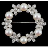 A late 20th century white gold cultured pearl and diamond cluster set openwork circular brooch, with