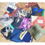 A collection of vintage silk scarves including Lanvin, Yves Saint Laurent, Maggy Rouff and one
