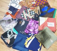 A collection of vintage silk scarves including Lanvin, Yves Saint Laurent, Maggy Rouff and one