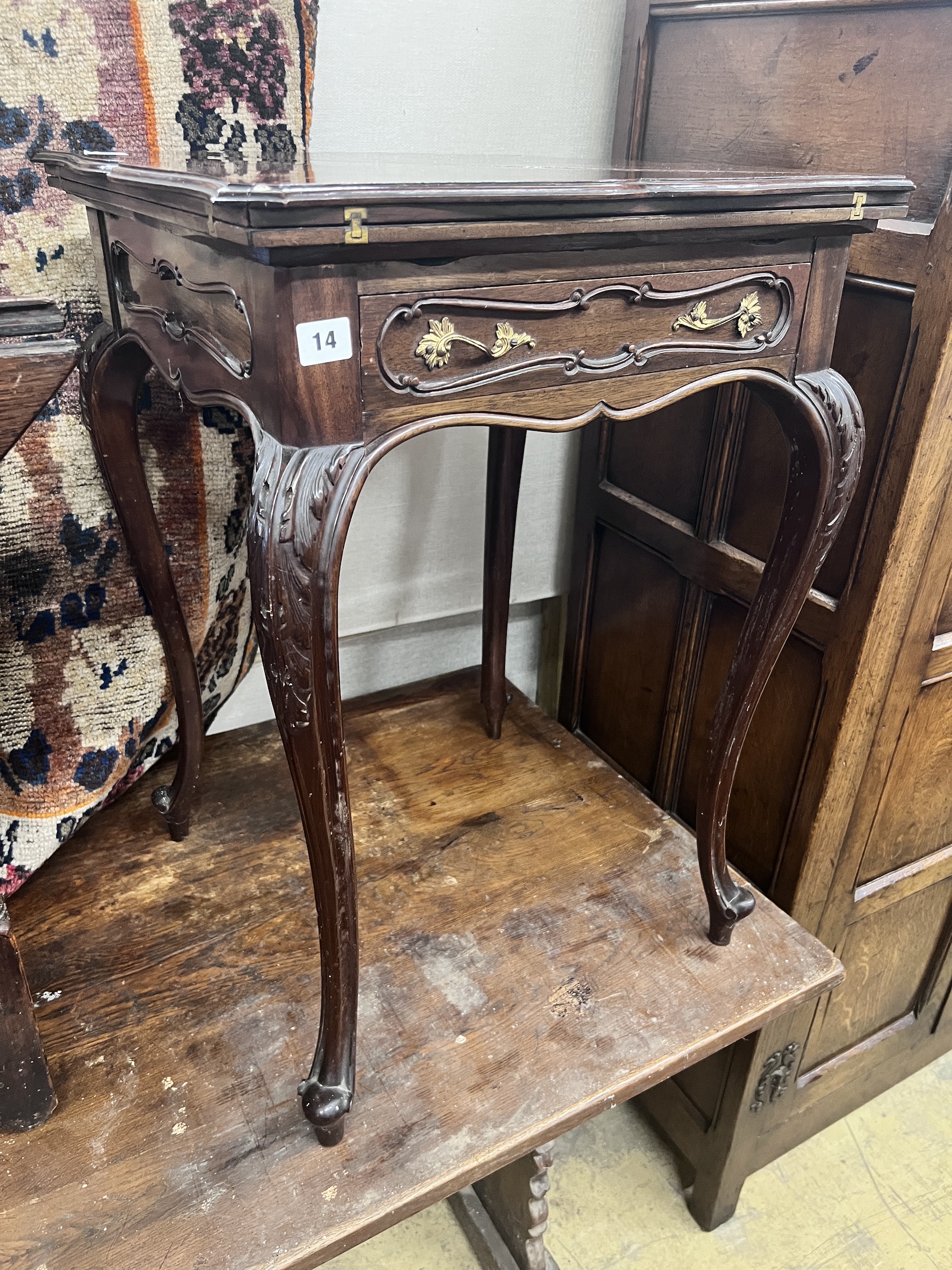 A late Victorian mahogany envelope card table, width 51cm, depth 51cm, height 75cm