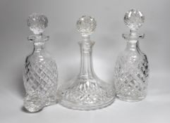 A pair of Waterford Colleen pattern decanters, a ships decanter a and four stoppers