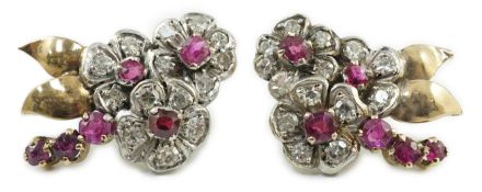 A pair of 1950's gold ruby and diamond set triple flower head cluster earrings, 24mm, gross weight