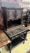 An 18th century style Flemish carved oak side cabinet, width 80cm, depth 62cm, height 165cm