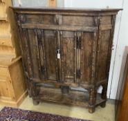 A 17th century style panelled oak side cabinet constructed from old timber, width 157cm, depth 29cm,