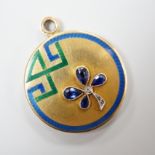 An Art Deco yellow metal, three colour enamel, synthetic? sapphire and diamond set circular