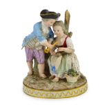 A Meissen group of a boy and a girl with a piccolo, 19th century, the oval base modelled with two