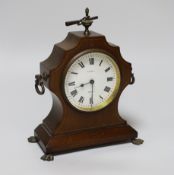 A small mahogany mantel timepiece with key, the dial inscribed B W Fase, 21cm high