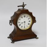 A small mahogany mantel timepiece with key, the dial inscribed B W Fase, 21cm high