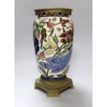 A Zsolnay Pecs brass mounted vase decorated with a peacock amongst flowers, 30cm high