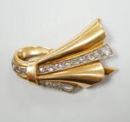 A 1940's/1950's French? yellow metal and graduated rose cut diamond set stylised fan clip brooch,