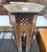 A Moorish mother of pearl inlaid hexagonal occasional table, width 32cm, height 46cm