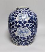 A large Chinese blue and white jar painted with a dragon amongst leaves and flowers, 29cm high