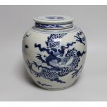 An 18th/19th century Chinese blue and white ‘dragon’ jar, with associated cover, jar 20.5cm high