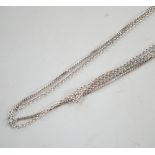 Three assorted modern 18ct white gold fine link chains, longest 42cm, 5.9 grams.