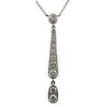 A modern 18ct white gold and graduated eleven stone diamond set drop pendant necklace, 51cm, gross