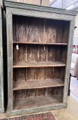 An Indonesian painted open bookcase, width 138cm, depth 43cm, height 203cm